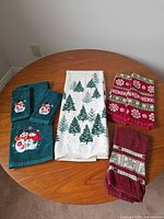 All six towels laid on round wooden table