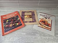 Front covers of all three cookbooks