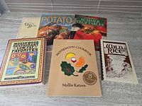 All six cookbooks laid out