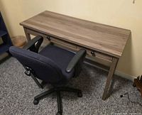 desk with chair positioned in front