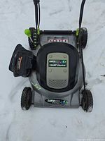Top view of Earthwise 12-Amp electric lawn mower, branding and motor cover visible