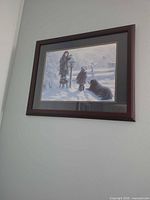 Print on wall showing frame, artwork and matting