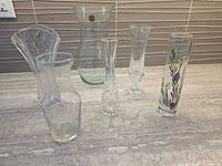 All six vases on countertop, front view