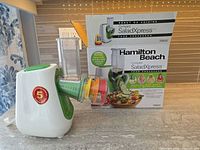 Appliance with box, attachments visible