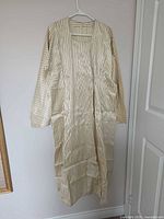 Full view of striped Japanese men’s robe on hanger