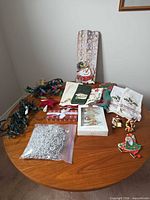 All items overview on table: sign, towels, lights, ornaments, bead garland
