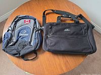 Samsonite carry-on suitcase and Domtar backpack on table