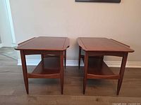 Pair of matching wood end tables front view