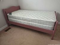 Full view of assembled twin bed with mattress and boxspring
