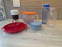 Group shot of all Tupperware items and bottles