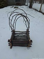 Front view of rectangular twig planter with arched handle