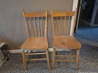 Front view of both wooden chairs side by side