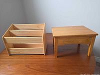 Magazine rack and foot stool on table, full view