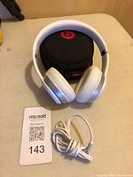 Headphones, case and audio cable overview