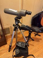 Overall lot showing both spotting scopes on tripods and night-vision monocular with case