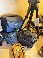 Tripod and four bags grouped together