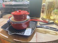 Remy Olivier pot with lid stacked on Staub grill pan, overall view