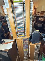 Full view of two CD tower stands filled with CDs