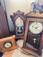 Group shot showing all three clocks: wall, mantel, ship-wheel
