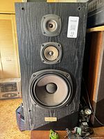 Front view of first Kenwood JL-525 speaker showing drivers and badge