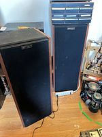 Both Klipsch tower speakers with grilles installed