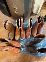 All five pairs of boots arranged on floor