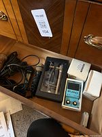Drawer containing microphones, boxed Lax-Maxe set, chorus pedal and cables