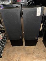 Front view of both Post Audio tower speakers with grilles