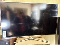 Front view of RCA 46" LED TV on stand