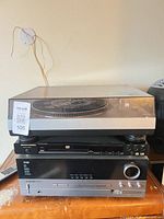 Stacked view of Stanton turntable, Marantz DVD player, Harman Kardon AVR 235 receiver