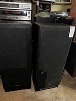 Front view of both Technics speakers with grilles