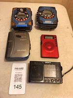 Group shot of all five devices showing fronts and relative sizes