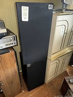 Two black dB Plus speaker cabinets stacked with visible brand logos