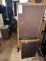 Two matching floor speakers front view showing size and finish