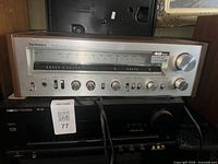 Technics SA-303 receiver stacked over Harman Kardon receiver