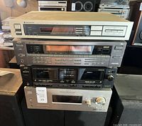 Stack of four audio components showing overall lot