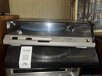 Stacked turntables, Dual on top, Realistic below, showing overall condition