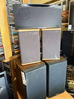 Group view: center speaker atop two Advent speakers, atop two Bisonic speakers