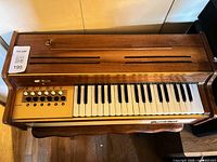 Top view of entire Frontalini chord organ on stand