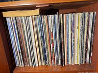 Full shelf showing entire row of LP spines
