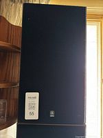 Front view of one Yamaha speaker with grille and logo