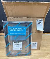 Sealed Gumdrop case in front of original shipping carton