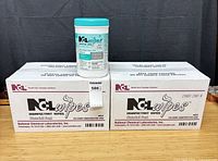 Two sealed shipping boxes with one canister displayed on top