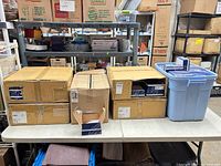 Stack of Bosch NDA-5031-PIP boxed units on table with additional units in plastic tote