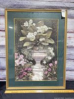 Front view of framed floral print showing artwork, mat, frame