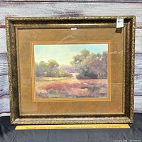 Front view of framed landscape painting