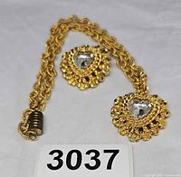 Necklace and brooch full view showing design and chain