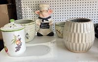 Overview of all five ceramic pieces on shelf