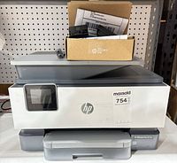 Front view of HP OfficeJet Pro 9010e with Instant Ink cartridge box on top
