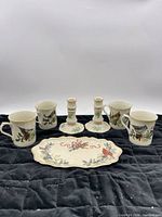 Seven matching Lenox Winter Greetings pieces displayed